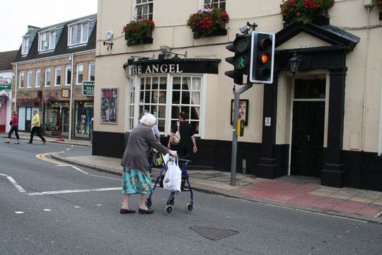 picture of a lady walking across a signalised crossing